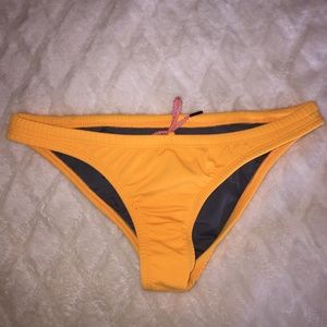 JOLYN Europe Swim Bottoms | Orange/yellow
